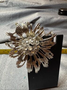 Source Unknown Silver Floral Rhinestone Burst Brooch